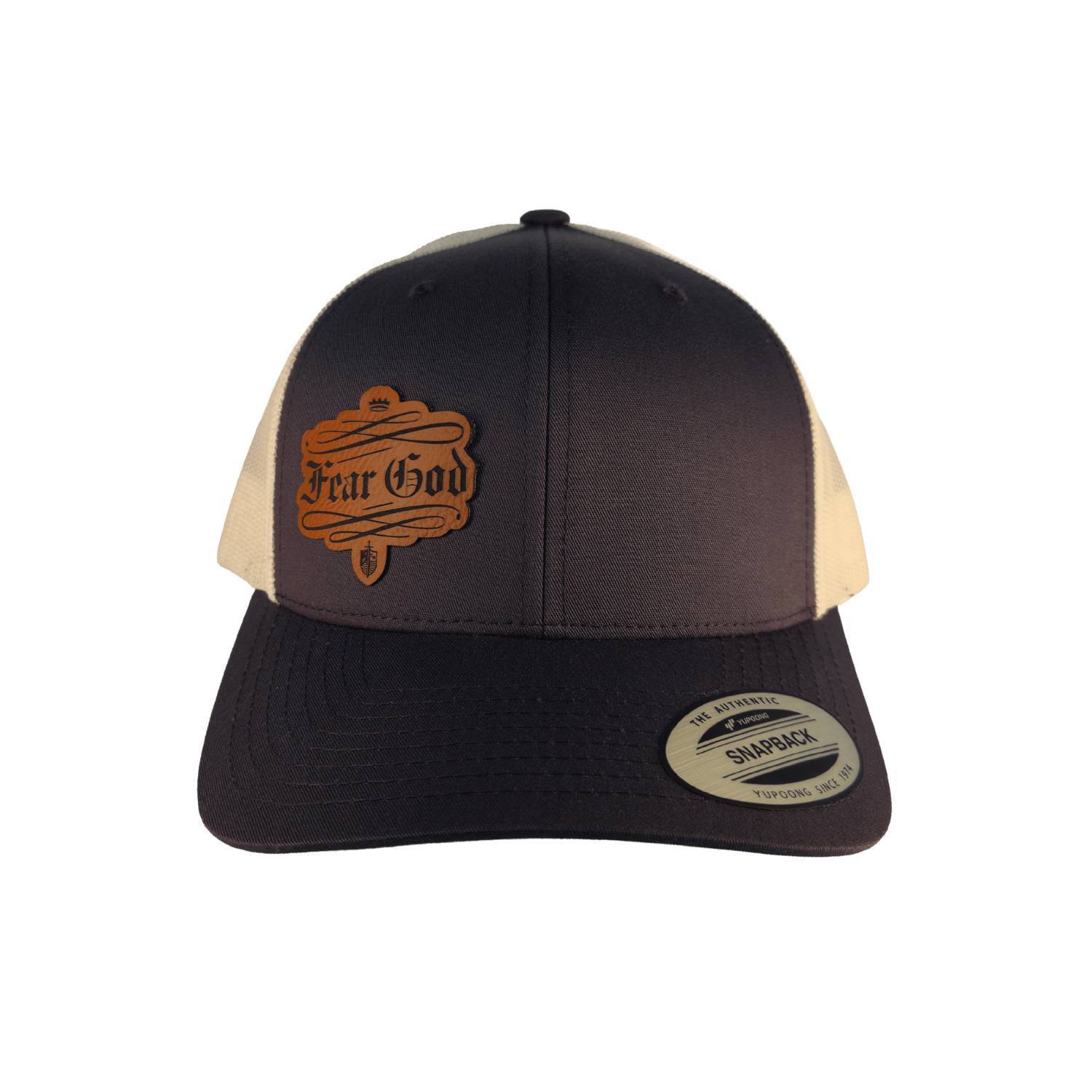A two-tone trucker hat with a dark brown front and brim, beige mesh back panels, and a brown leather patch on the front that reads 'Fear God'. [Grey]