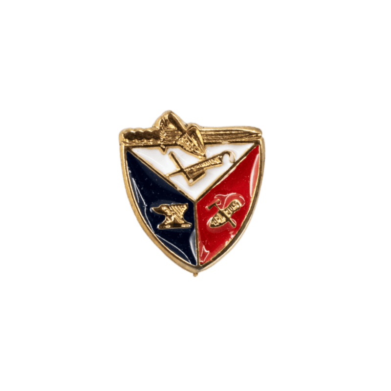 A small shield-shaped enamel pin with a gold-tone border, divided into navy blue and red sections with a white center, featuring gold-tone symbols and a small star at the top, shown on a plain white background.