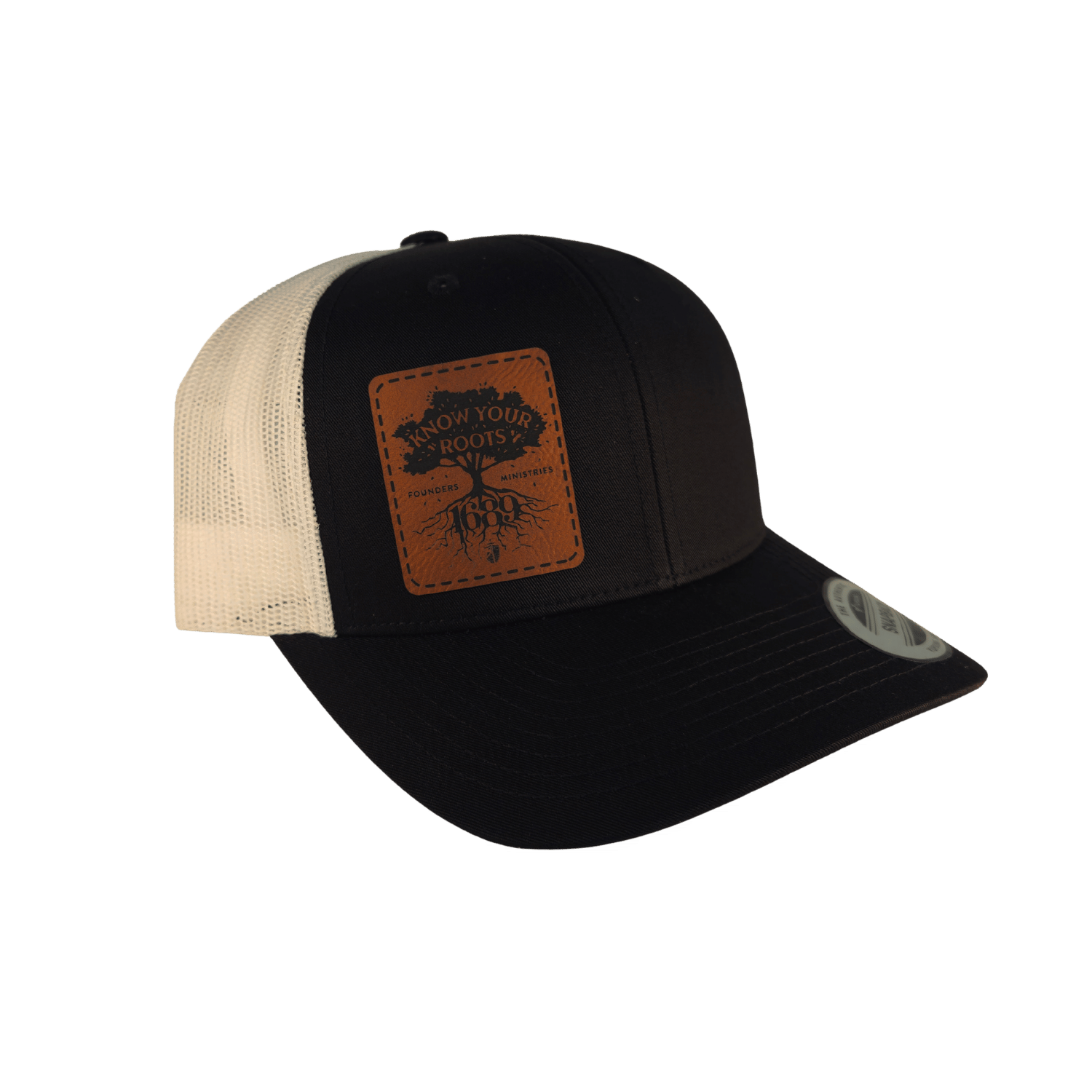 A black trucker hat with a brown leather patch on the front displaying 'Know Your Roots 1689' and a tree graphic.