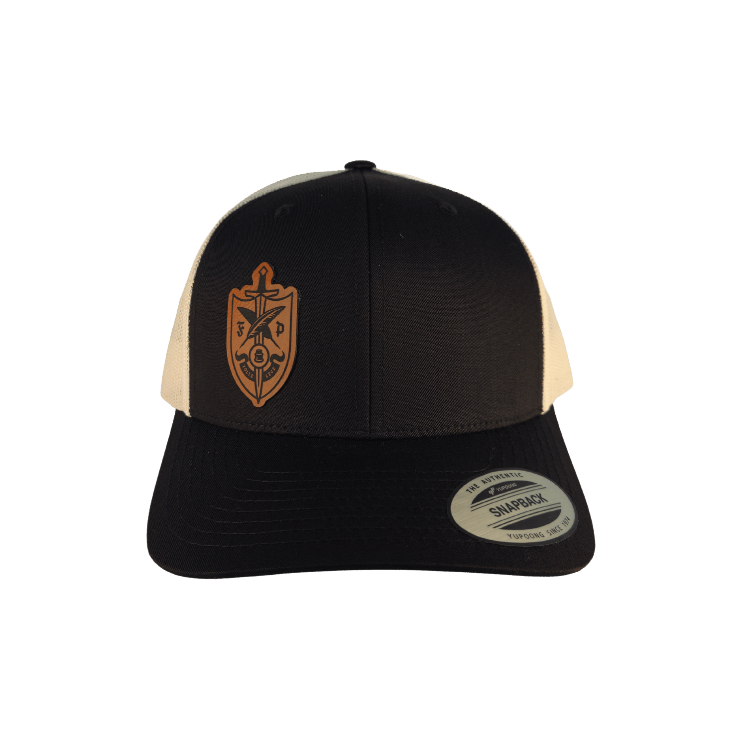 A black and off-white trucker hat featuring a brown shield emblem on the front panel 