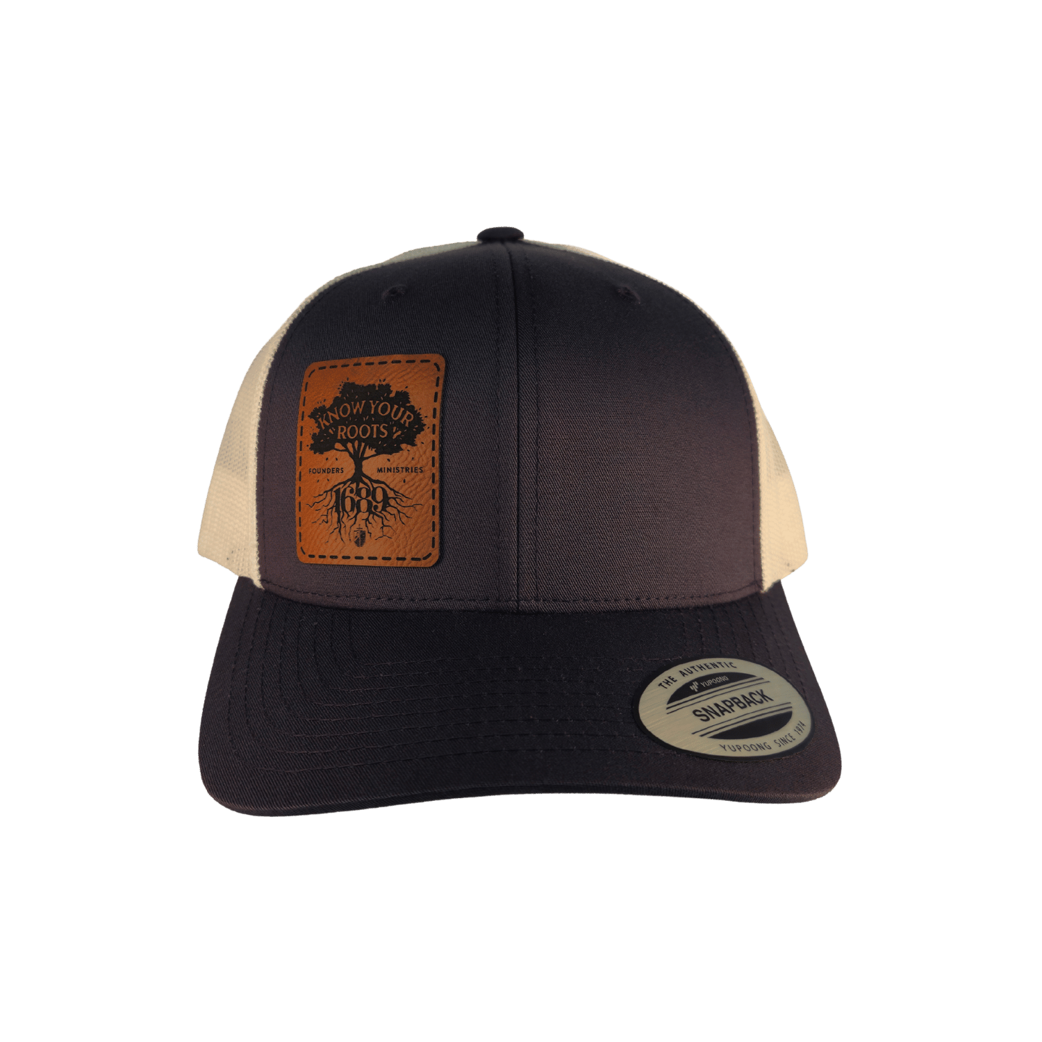 A grey trucker hat with a brown leather patch on the front displaying 'Know Your Roots 1689' and a tree graphic.