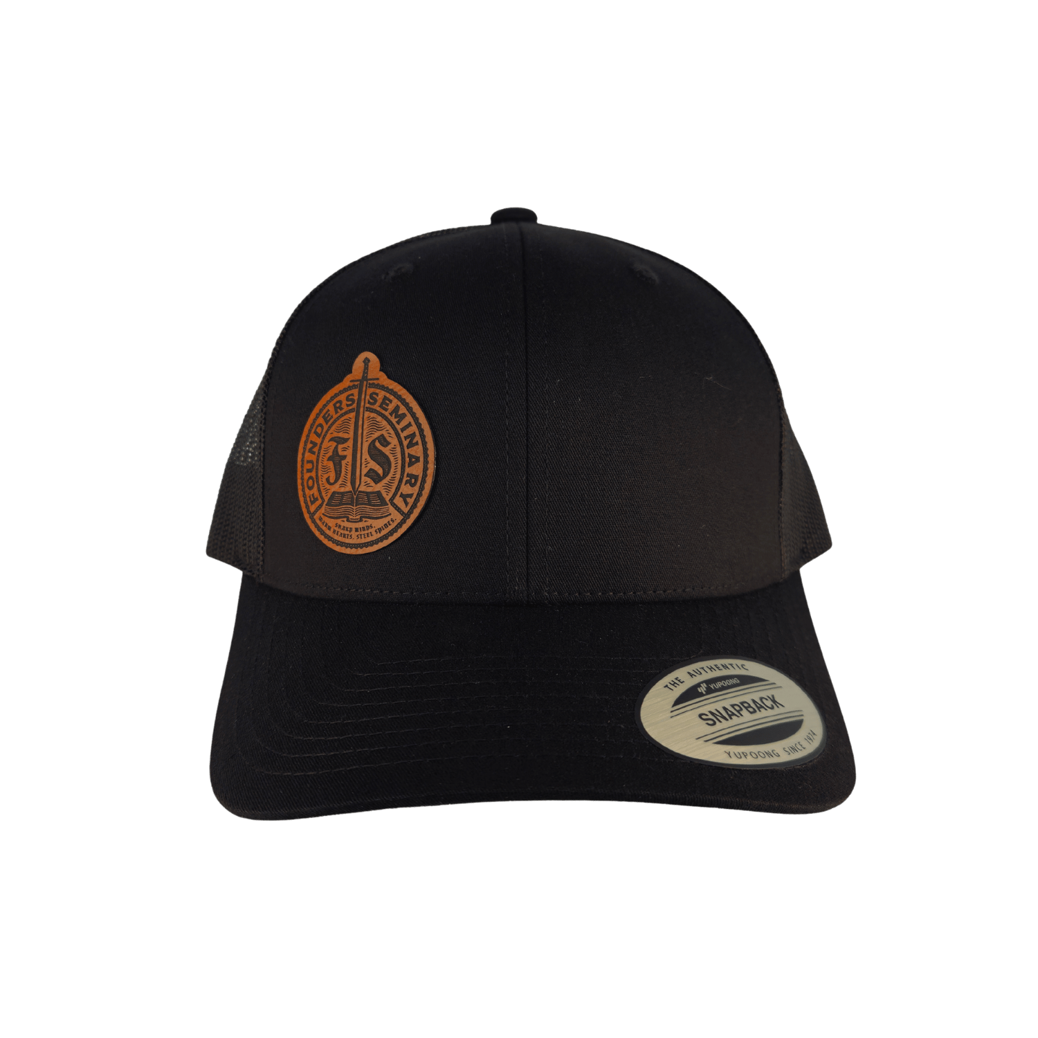 A black trucker-style cap with a circular brown embroidered emblem on the front and a visible Snapback sticker on the brim.