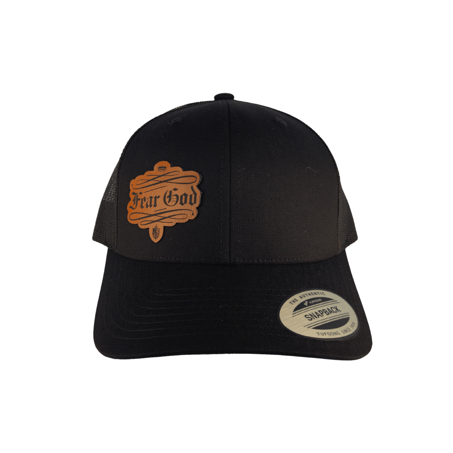 A black trucker-style cap with a curved brim, featuring a brown embroidered 'Fear God' patch on the front and a visible Snapback sticker on the brim. [Blackout]