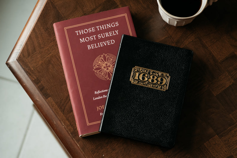 Two Books on a table with a cup of coffee