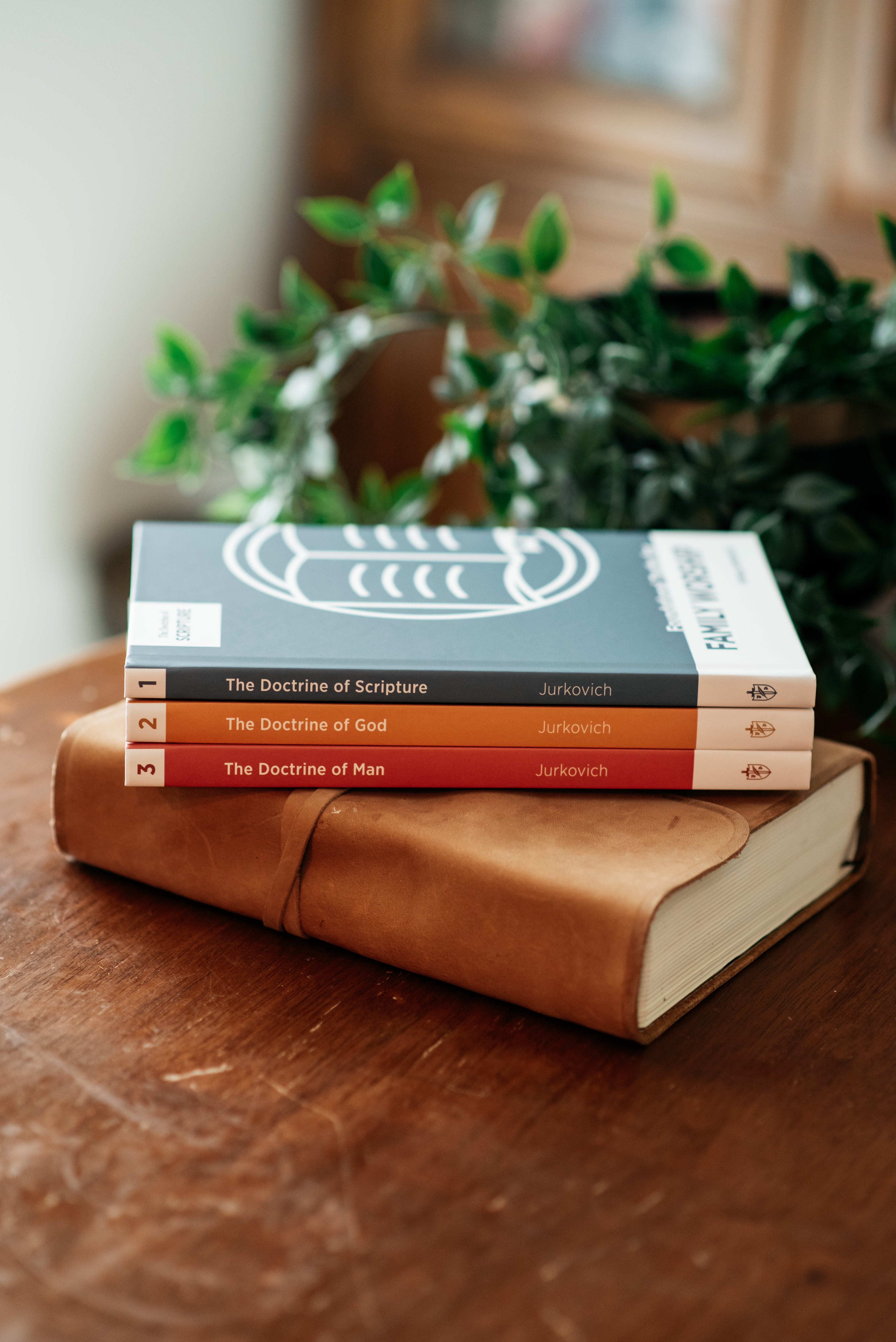 Picture of Family Worship book series on wood table. 