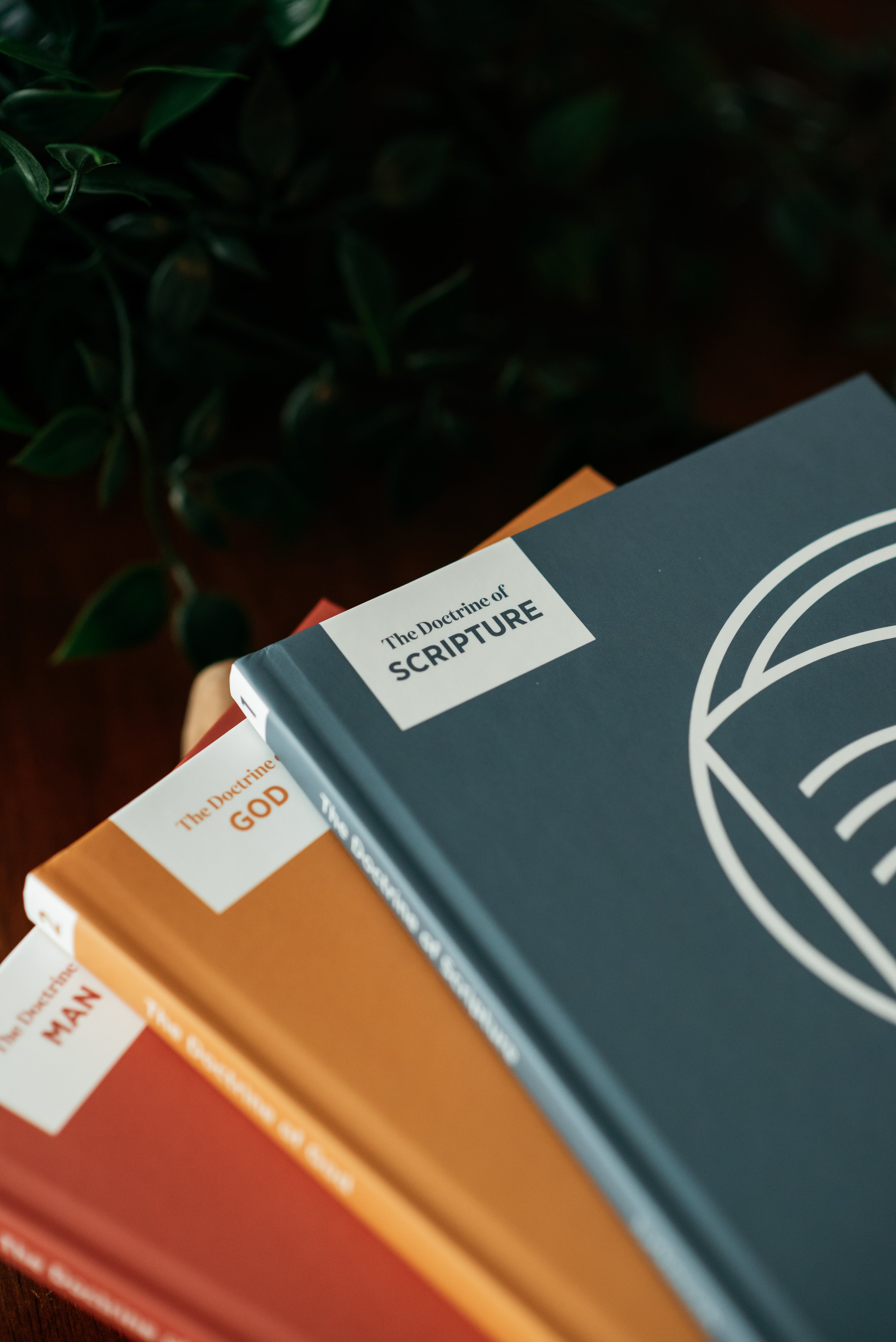 Close up picture of front covers of the first three family worship guides. 