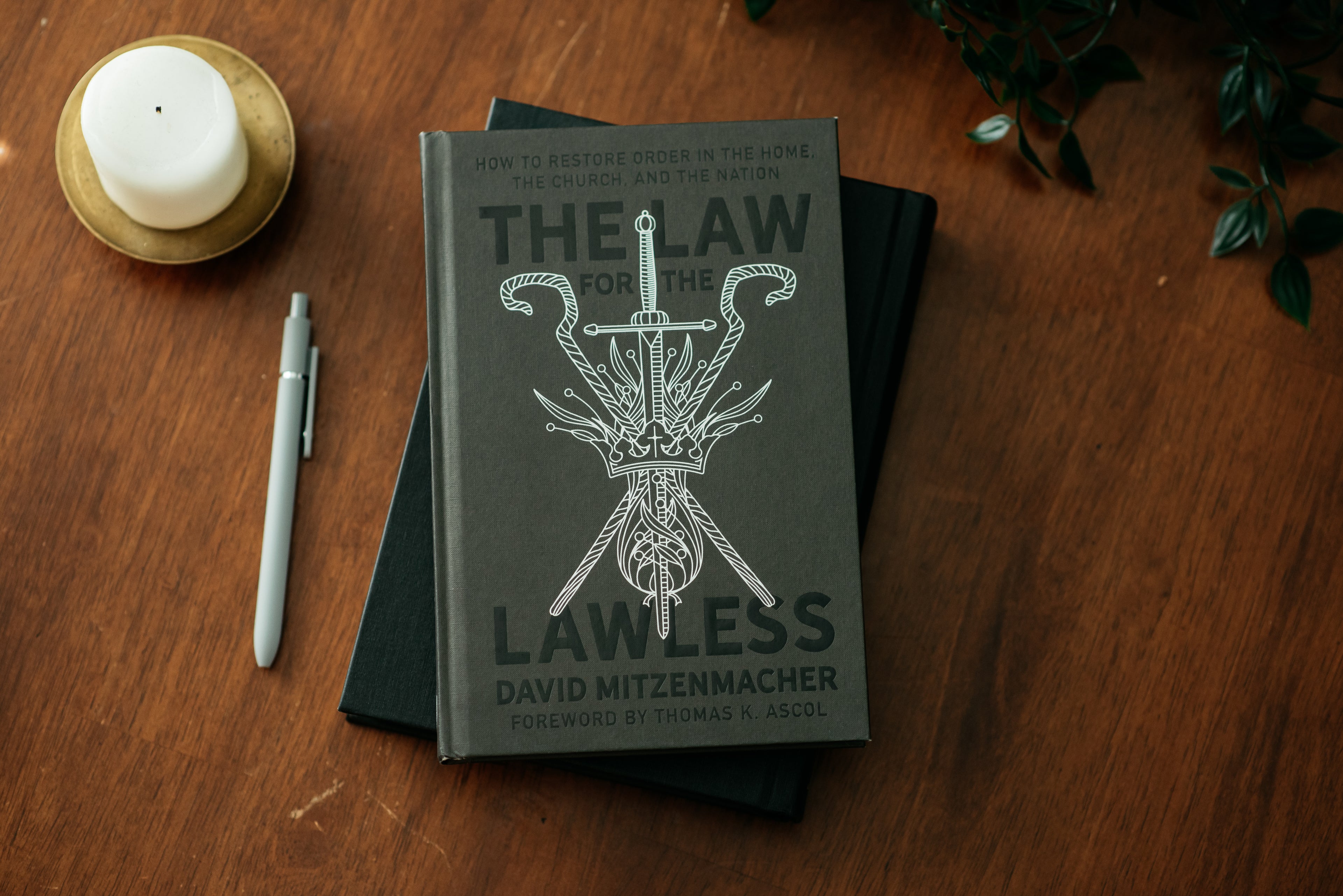 Copy of the book "The Law for the Lawless" on a wood table. 