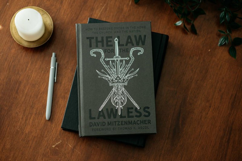 Copy of the book "The Law for the Lawless" on a wood table. 