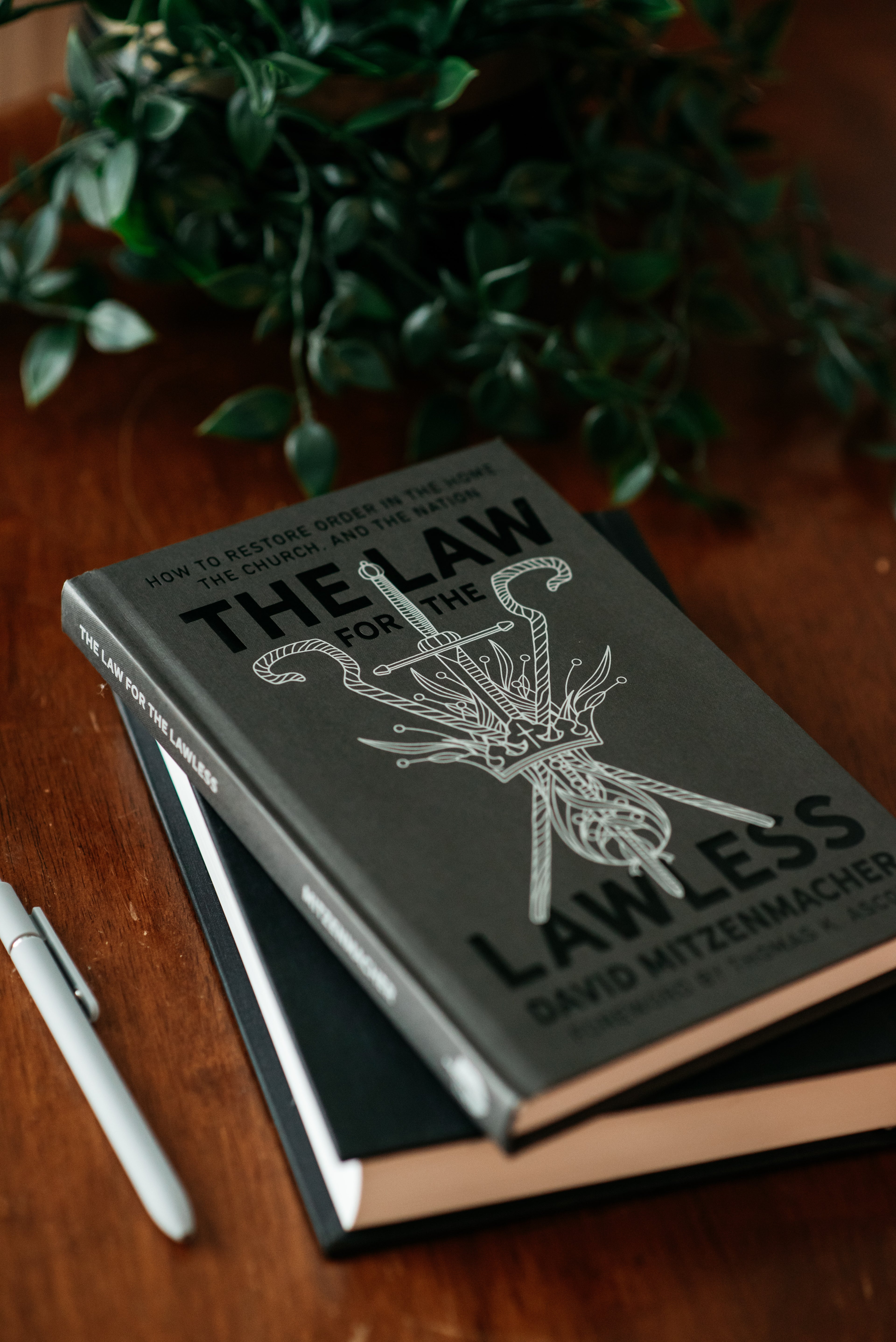 Copy of the book "The Law for the Lawless" on a wood table. 