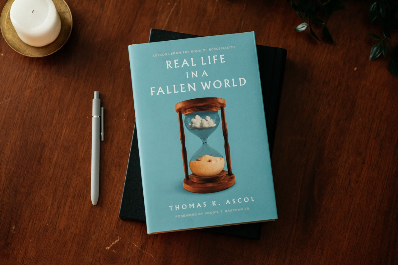 Real Life in a Fallen World on wood table