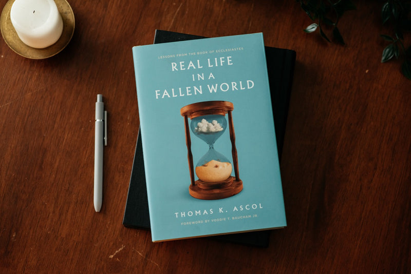 Real Life in a Fallen World on wood table