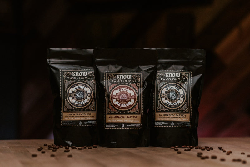 Three Bags of Know Your Roast Coffee: New Hampshire Light Roast Coffee on wood table