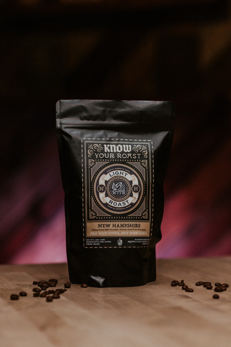 Bag of Know Your Roast Coffee: New Hampshire Light Roast Coffee on wood table