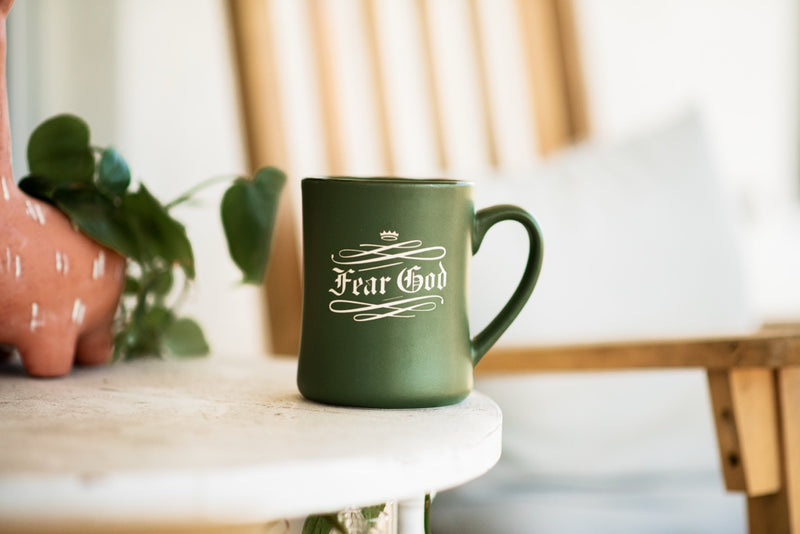 Fear God Mug on table outdoors