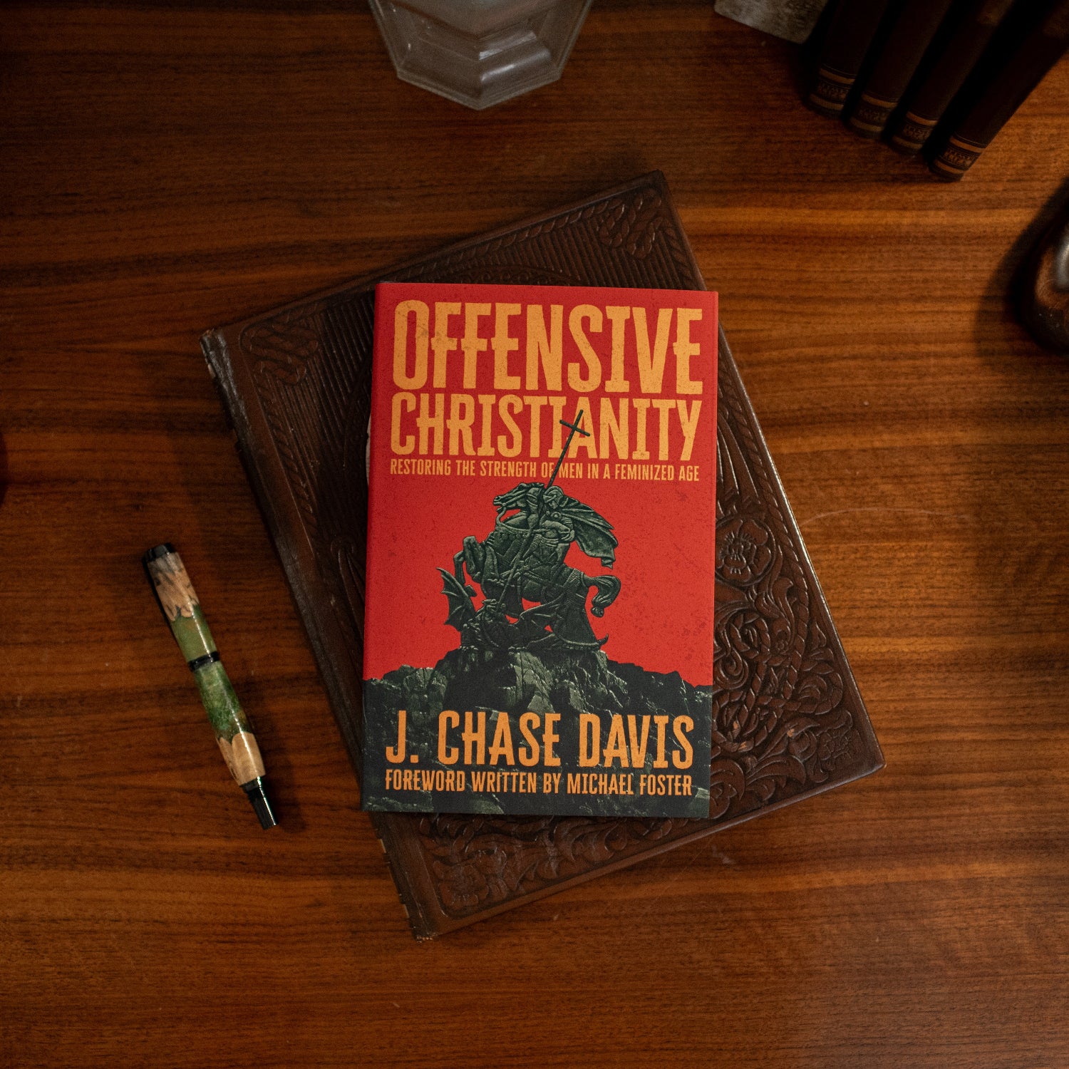 Offensive Christianity by J. Chase Davis on a wooden table