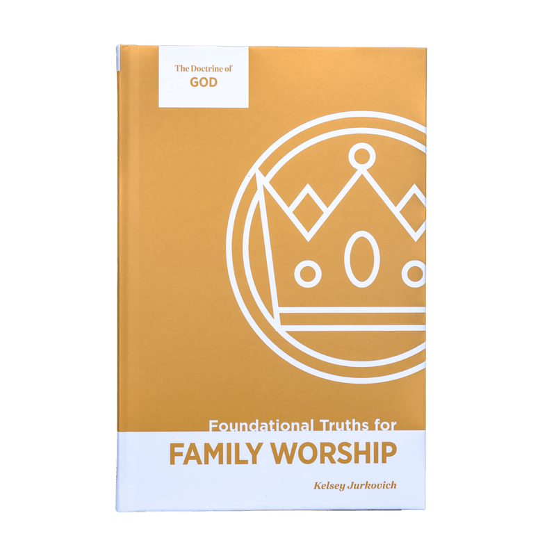 A book titled 'The Doctrine of God: Foundational Truths for Family Worship' by Kelsey Jurkovich, shown standing upright. The book cover is primarily a warm mustard yellow with a white lower section and a white line-art crown graphic.