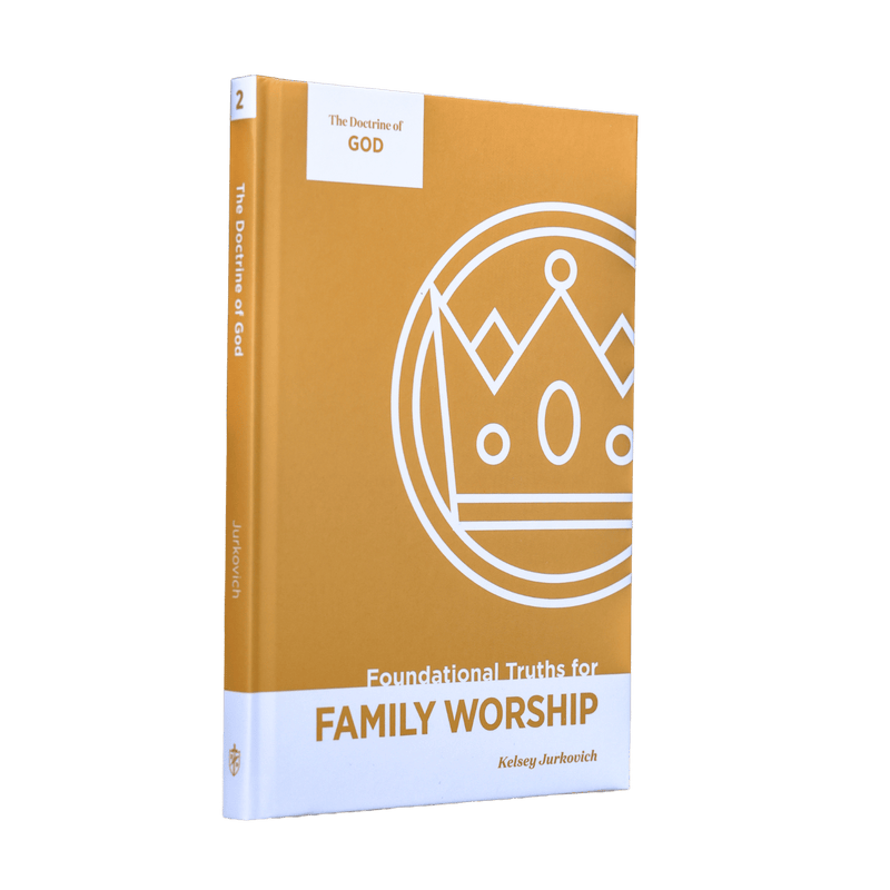 A book titled 'The Doctrine of God: Foundational Truths for Family Worship' by Kelsey Jurkovich, shown standing upright. The book cover is primarily a warm mustard yellow with a white lower section and a white line-art crown graphic.