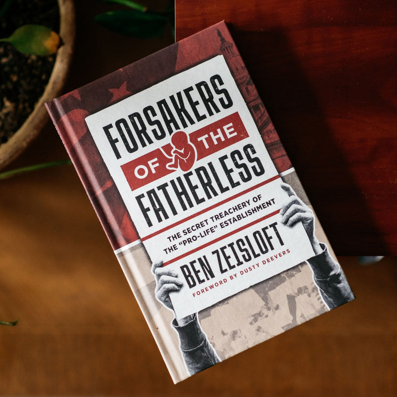 Book titled 'Forsakers of the Fatherless' by Ben Zeisloft on a wooden surface.