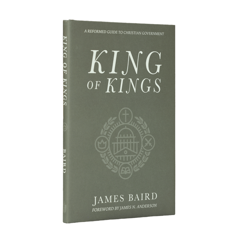 The front and spine of the book 'King of Kings' by James Baird, featuring a muted gray cover with white text and a central crest design.