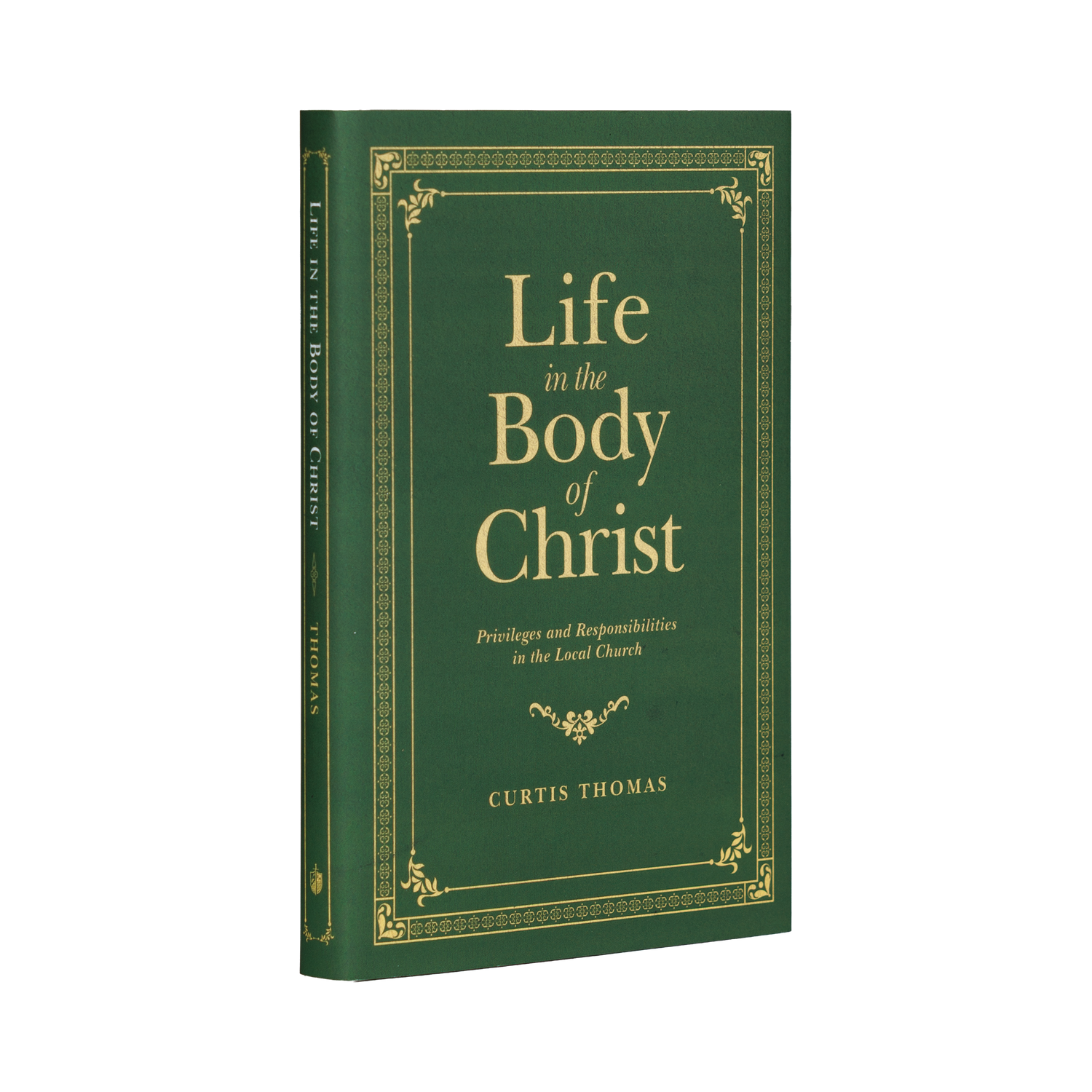 Book titled 'Life in the Body of Christ' by Curtis Thomas with a green cover and gold text on a white background.