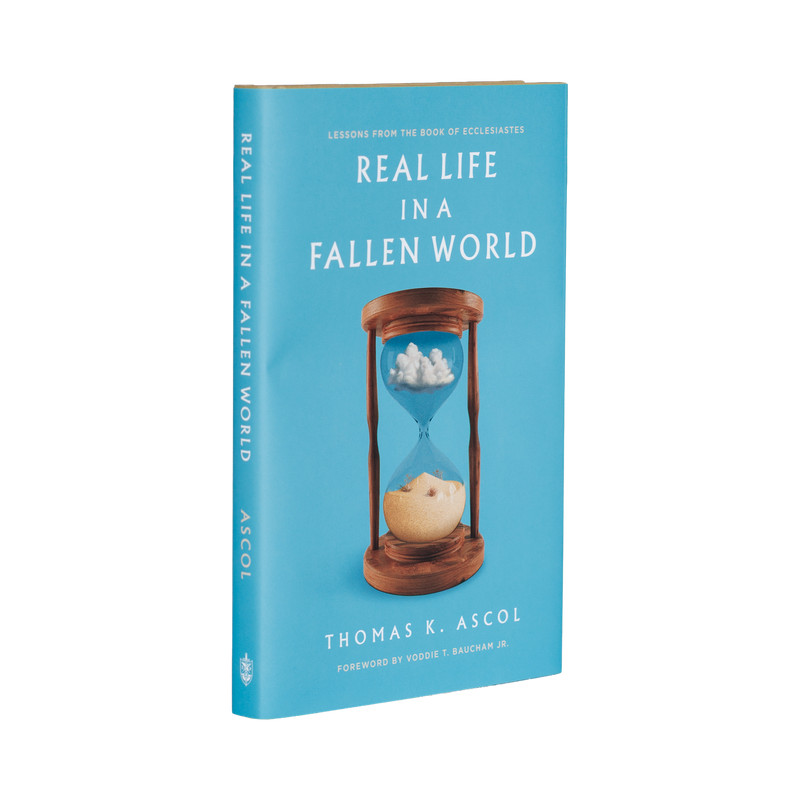 Book cover of 'Real Life in a Fallen World' with an hourglass illustration on a blue background